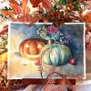 Aquarelle originale sur chevalet représentant une un potiron, une citrouille creusée façon Jack O'lantern et des chrysanthèmes éclairés à la bougie ©Ysae illustrations