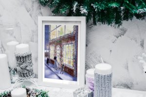 Impression laser présentée dans un cadre d'un dessin numérique représentant une mère et son enfant devant la vitrine allumée d'un magasin de jouets ©Ysae illustrations