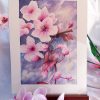 Dessin original à l'aquarelle représentant une branche de cerisier japonais et ses fleurs et présenté sur un chevalet @Ysae illustrations