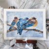Aquarelle originale représentant trois oiseaux, des merles bleus, sur une branche alors que la neige tombe @Ysae illustrations