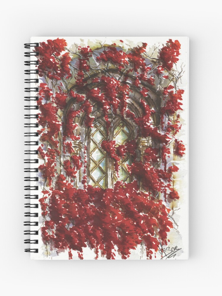 Carnet à spirales dont la couverture est un dessin à l'aquarelle et à l'encre représentant une fenêtre gothique recouverte des feuilles rouges d'un arbre à l'automne ©Ysae illustrations