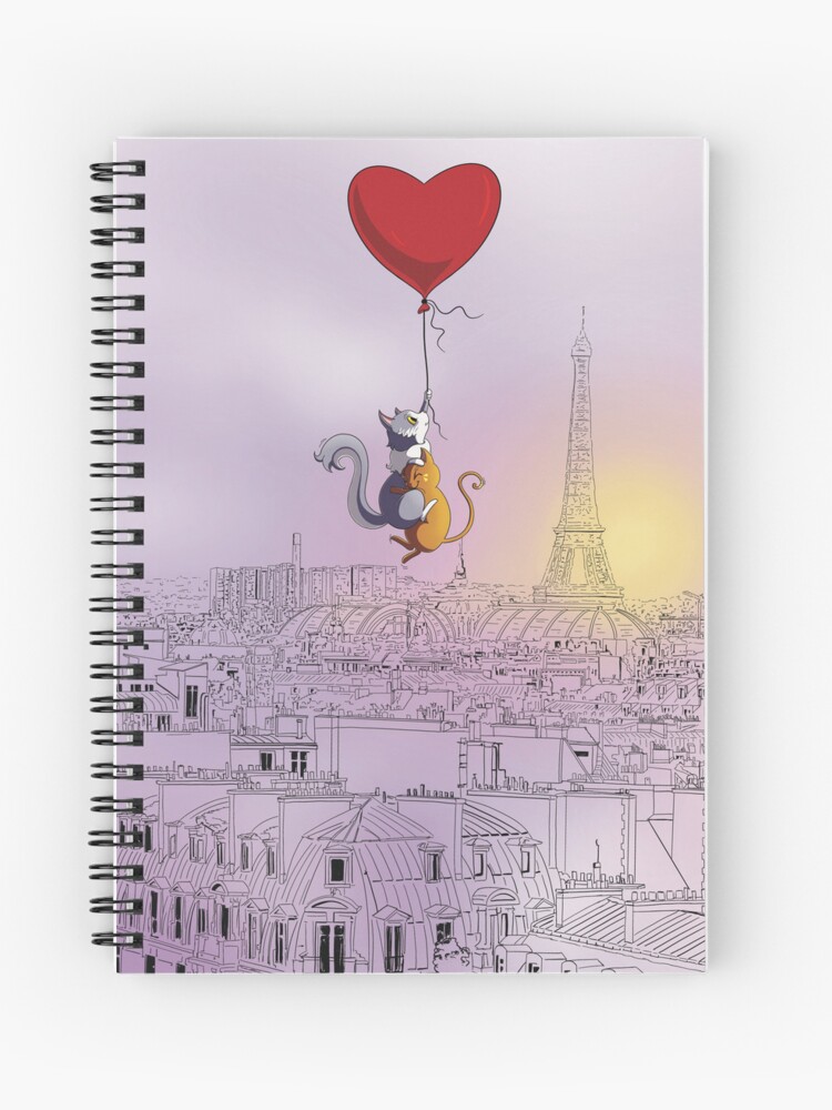 Carnet à spirales dont la couverture est un dessin numérique représentant deux chats mignons, des chats amoureux, qui survolent Paris accrochés à un ballon en forme de cœur ©Ysae illustrations