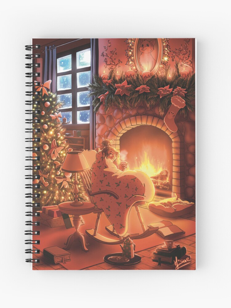 Carnet à spirales dont la couverture est un dessin numérique représentant une femme enroulée dans une couverture profitant d'un chocolat devant sa cheminée pendant Noël ©Ysae illustrations