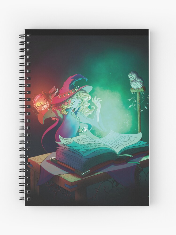 Carnet à spirales dont la couverture est un dessin numérique représentant une apprentie sorcière surprise par la lumière éclatant qui sort de son grimoire magique ©Ysae illustrations