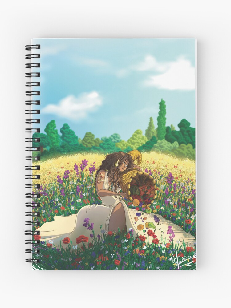 Carnet à spirales dont la couverture est un dessin numérique représentant la sorcière de l'été qui déverse les fruits de sa corne d’abondance dans l'herbe parsemée de fleurs ©Ysae illustrations