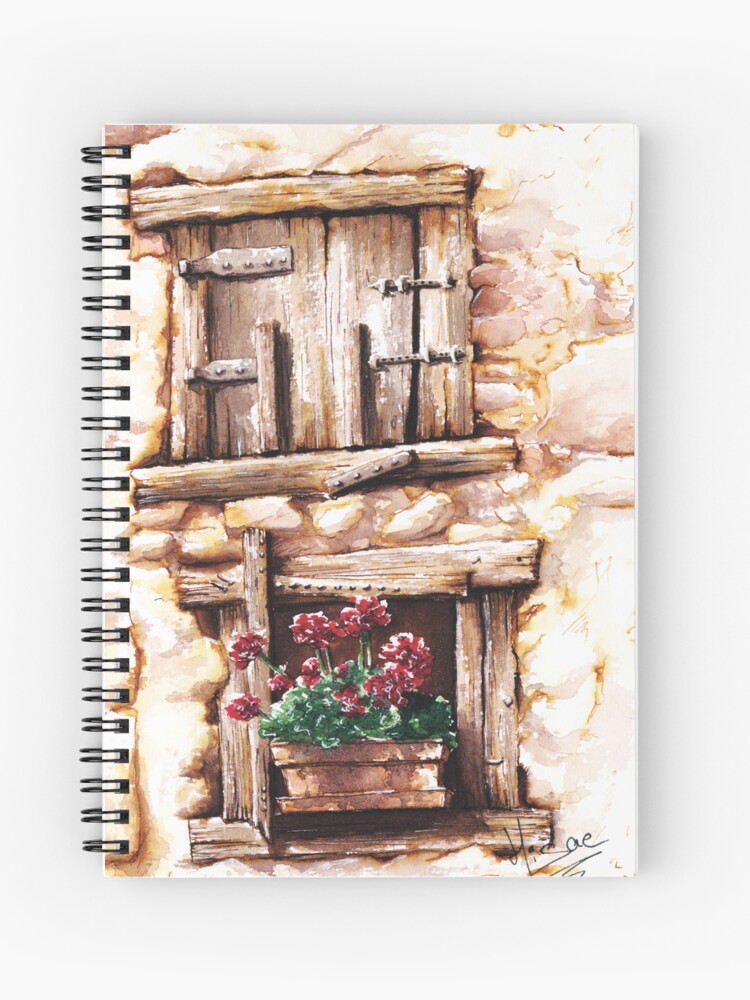 Carnet à spirales dont la couverture est un dessin à l'aquarelle et à l'encre représentant deux fenêtre aux volets de boi décorés de géraniums rouges ©Ysae illustrations
