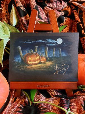 Dessin original à la gouache présenté sur un chevalet représentant deux citrouilles creusées façon Jack O'lantern pour Halloween au bord d'un chemin, une nuit de plein lune @Ysae illustrations