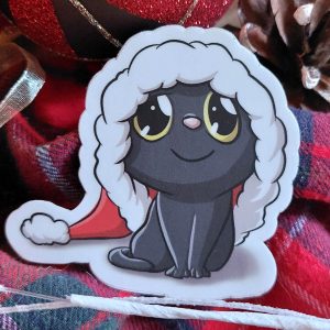 Sticker représentant un chat noir mignon avec un bonnet de père Noël trop grand @Ysae illustrations