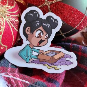 Sticker représentant une petite fille qui ouvre son cadeau de Noël @Ysae illustrations